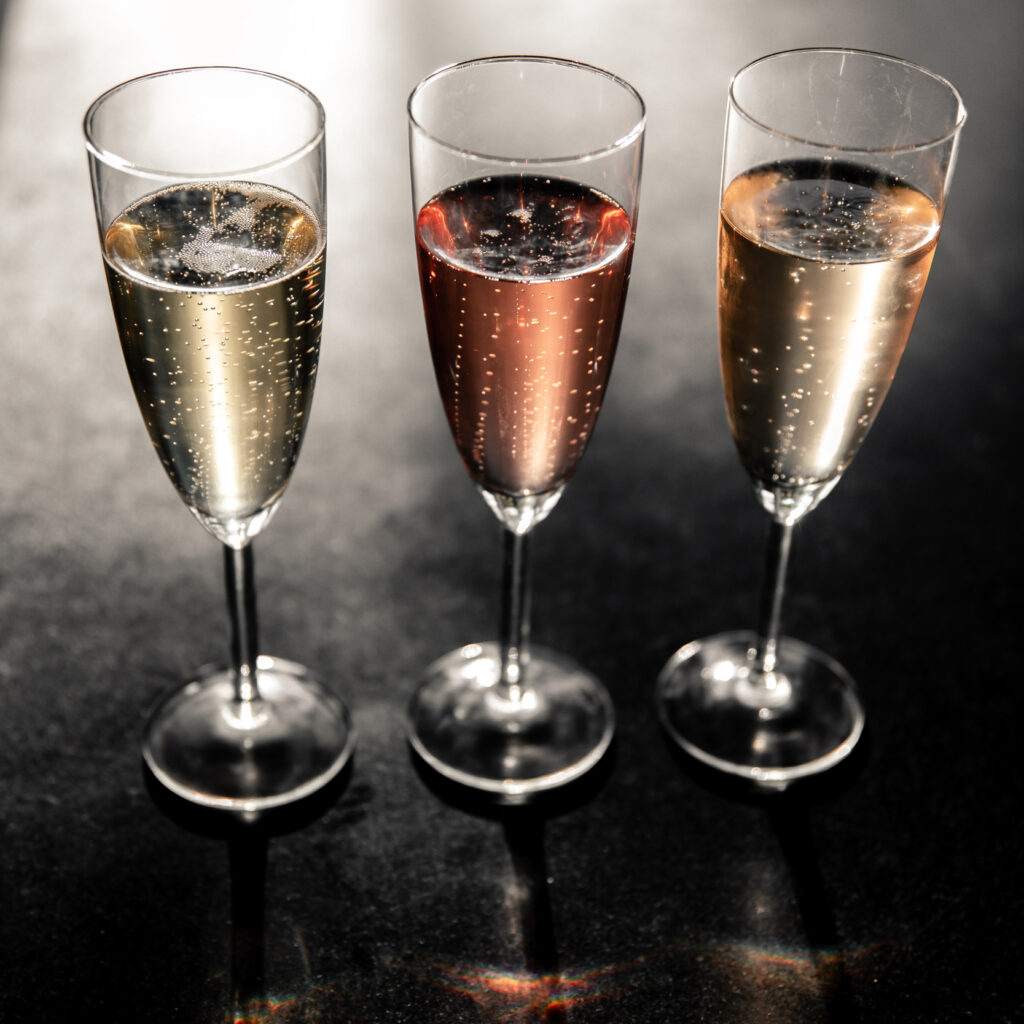 Three glasses of sparkling bubbles.